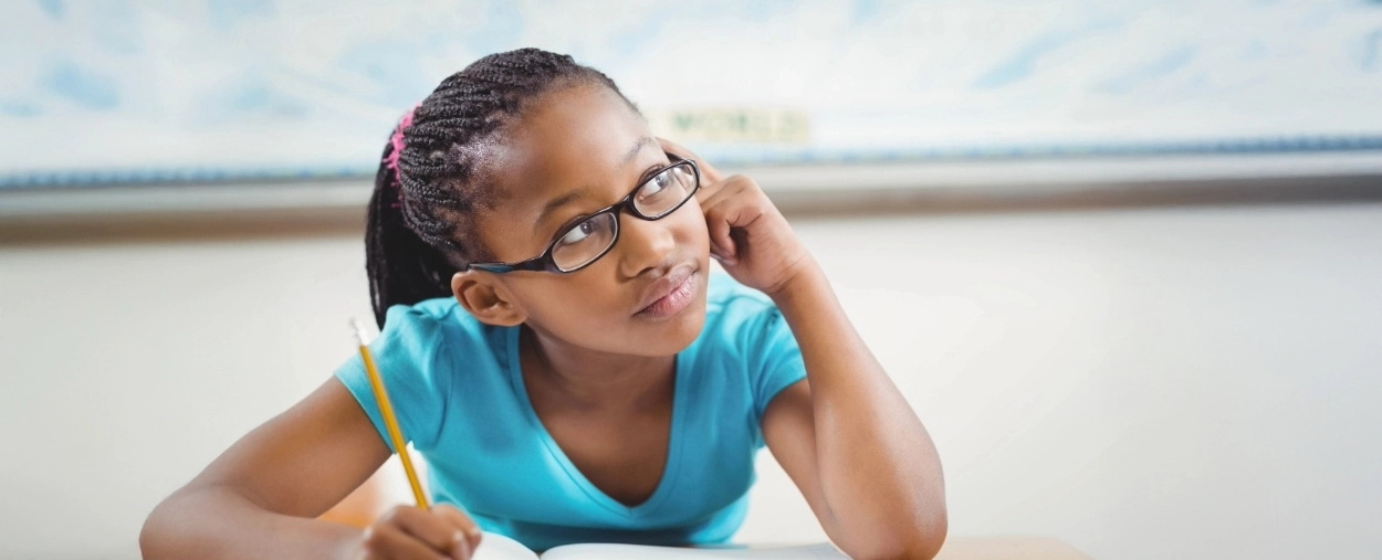 young girl thinking and looking up to the left